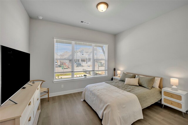 bedroom with light wood-type flooring