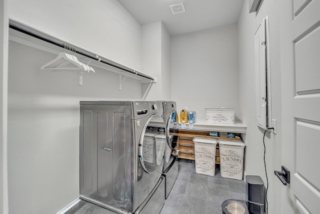 washroom featuring washer and clothes dryer