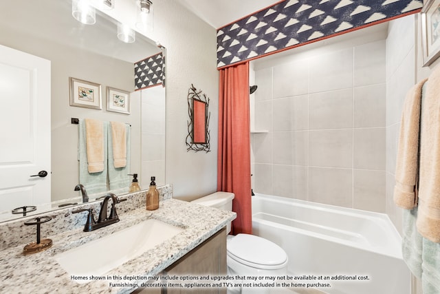 full bathroom featuring toilet, vanity, and tiled shower / bath