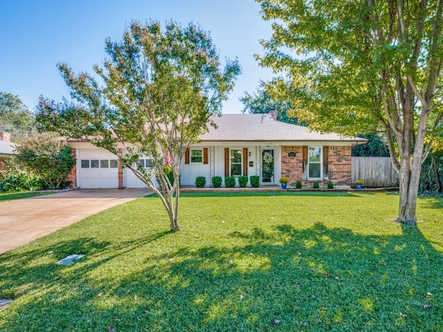 single story home featuring a garage, a front yard, and a porch