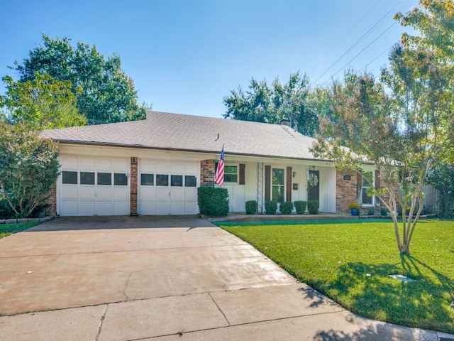 ranch-style home featuring a garage and a front yard