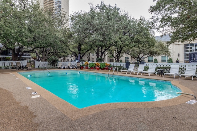 view of swimming pool featuring a patio area