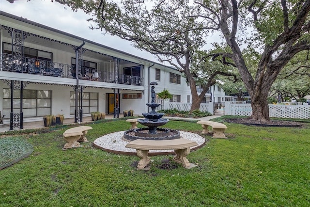 view of yard featuring a balcony