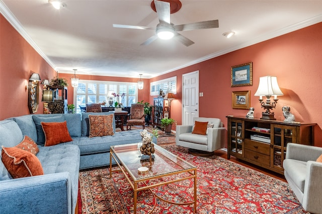 living room with ceiling fan and crown molding