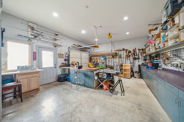 garage with a workshop area