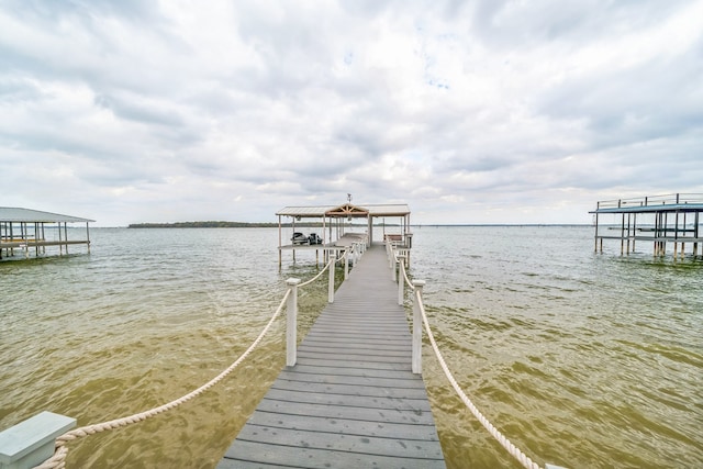 dock area featuring a water view