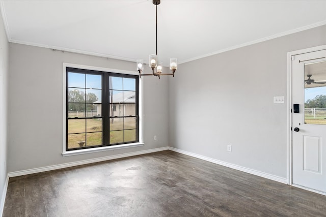 unfurnished room with dark wood-type flooring, a wealth of natural light, and crown molding