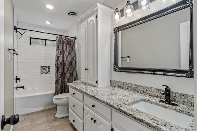 full bathroom featuring toilet, vanity, shower / bath combination with curtain, and tile patterned floors