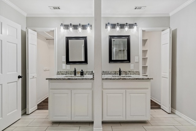 bathroom with vanity, hardwood / wood-style floors, and ornamental molding