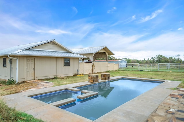 view of pool with an in ground hot tub