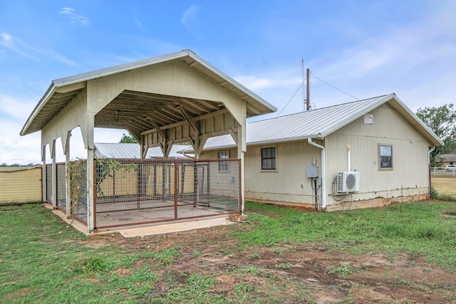 back of house with a patio area, a yard, and ac unit