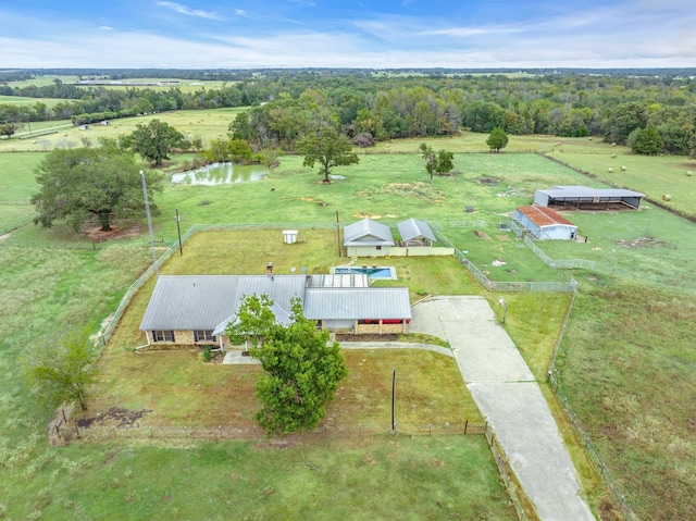 birds eye view of property featuring a water view and a rural view