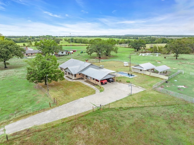 birds eye view of property with a water view and a rural view