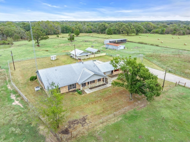 birds eye view of property with a rural view