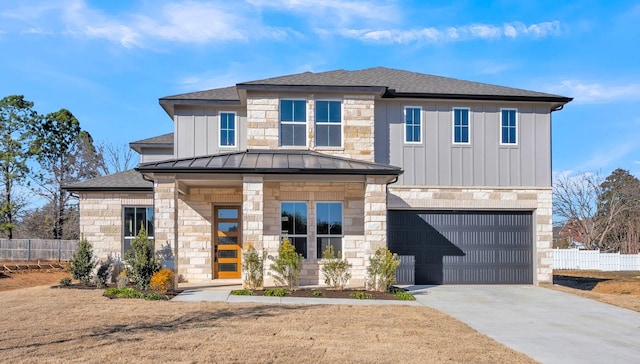 view of front of home with a garage and a front yard