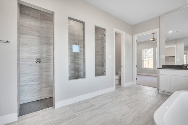 full bathroom with vanity, ceiling fan, toilet, and separate shower and tub