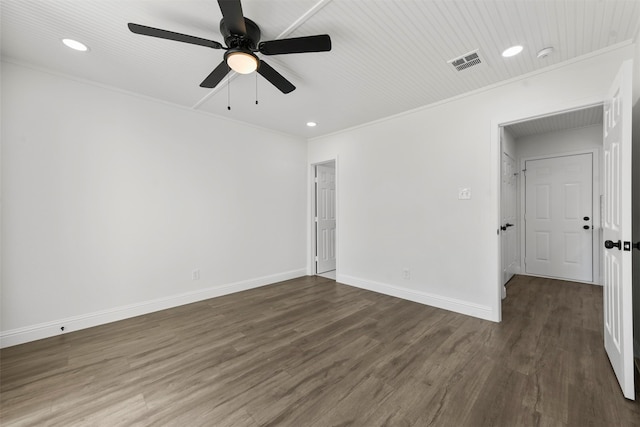 empty room with crown molding, ceiling fan, and dark hardwood / wood-style flooring