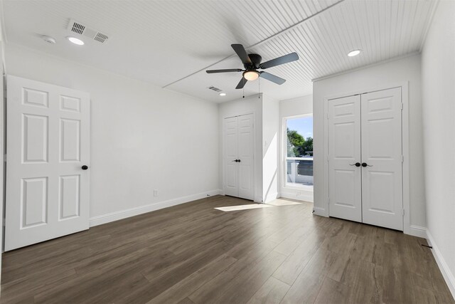 spare room featuring ceiling fan and dark hardwood / wood-style flooring