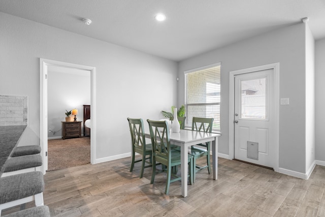 dining area with light hardwood / wood-style floors