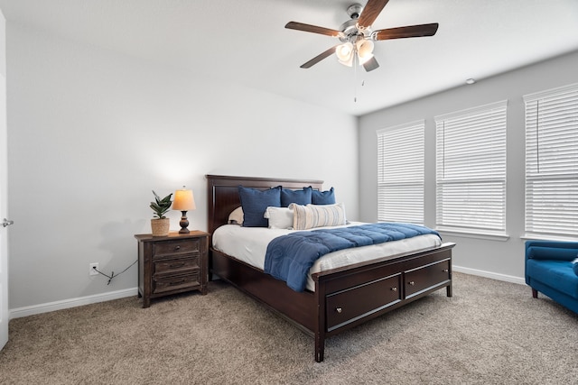 bedroom featuring ceiling fan and light colored carpet