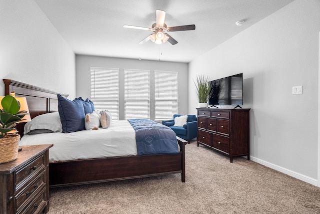 bedroom featuring light carpet and ceiling fan