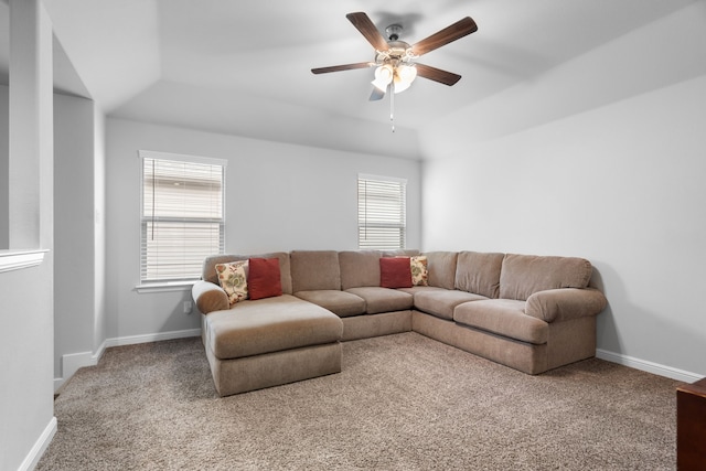 living room featuring ceiling fan, lofted ceiling, and carpet