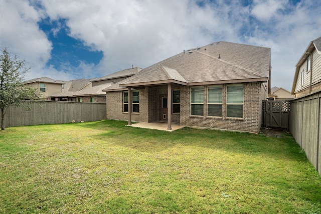 2614 Cowbird Way, Northlake, TX 76247 - back of property featuring a patio, a fenced backyard, brick siding, and a shingled roof