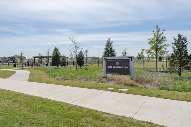 view of home's community with a lawn