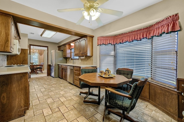 dining area with sink and ceiling fan