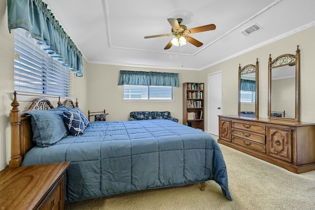 bedroom featuring carpet flooring, multiple windows, ceiling fan, and crown molding