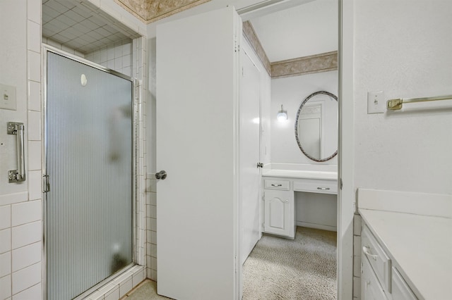 bathroom with an enclosed shower and vanity