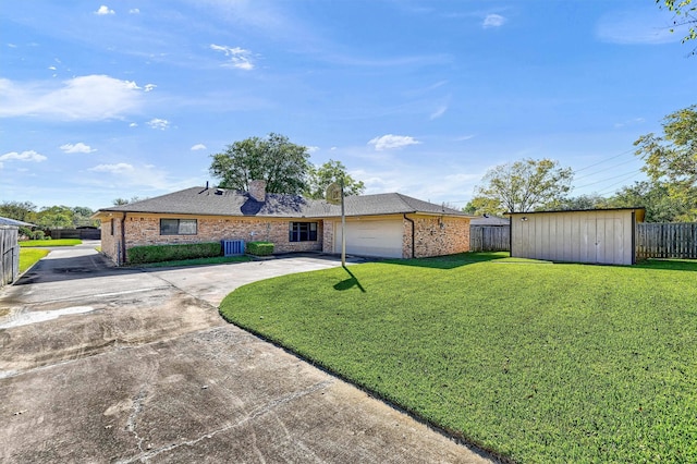 ranch-style house featuring a front lawn, a shed, a garage, and cooling unit