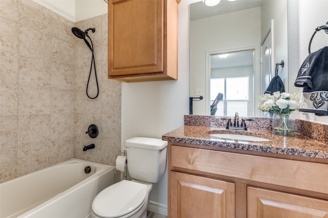 full bathroom featuring vanity, toilet, and tiled shower / bath combo