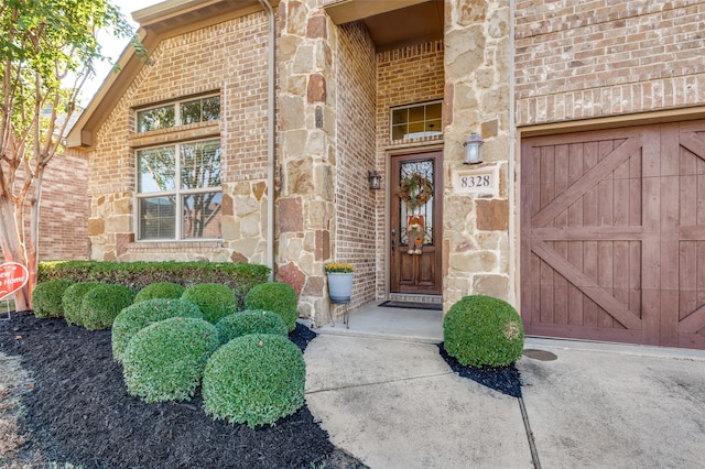 doorway to property featuring a garage