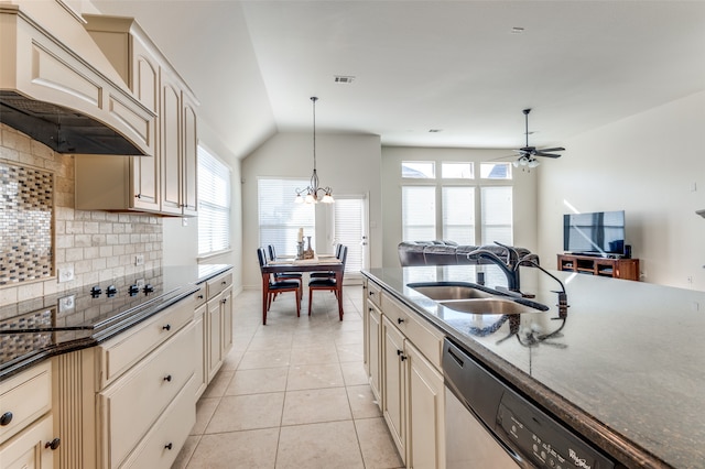 kitchen with sink, tasteful backsplash, premium range hood, lofted ceiling, and pendant lighting