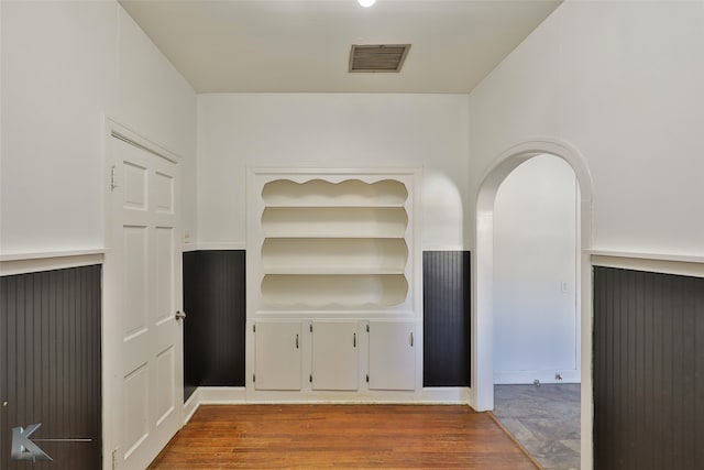 unfurnished living room featuring wood-type flooring