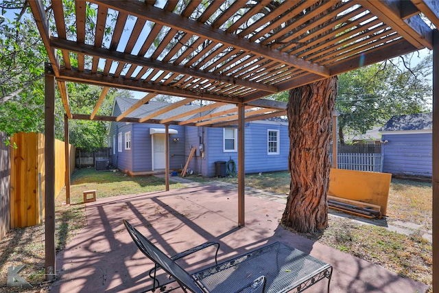 view of patio / terrace featuring a shed and a pergola