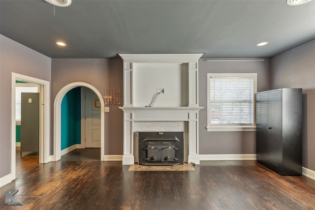 unfurnished living room with dark hardwood / wood-style floors