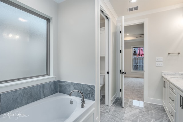 bathroom with toilet, a bath, vanity, and ornamental molding