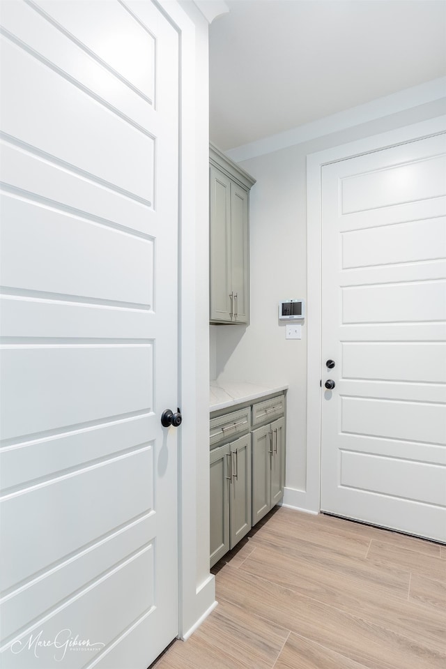 laundry room featuring light hardwood / wood-style flooring