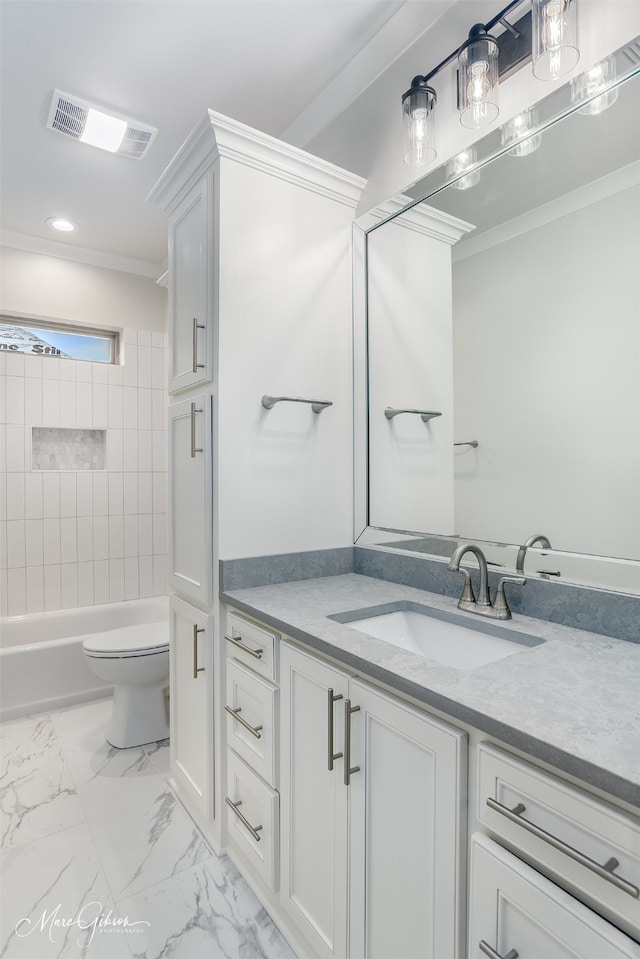 full bathroom featuring toilet, tiled shower / bath combo, and vanity