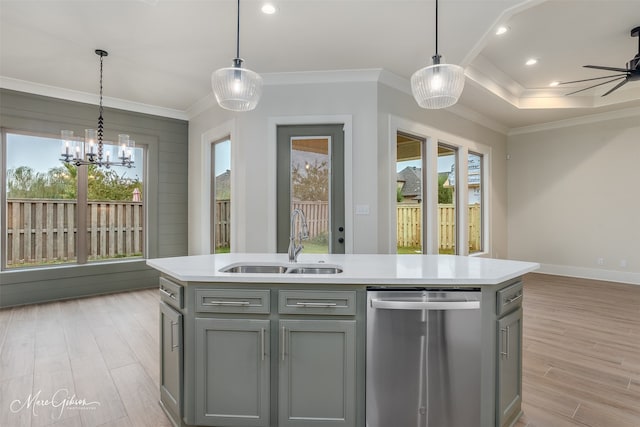 kitchen with light hardwood / wood-style floors, dishwasher, sink, an island with sink, and pendant lighting