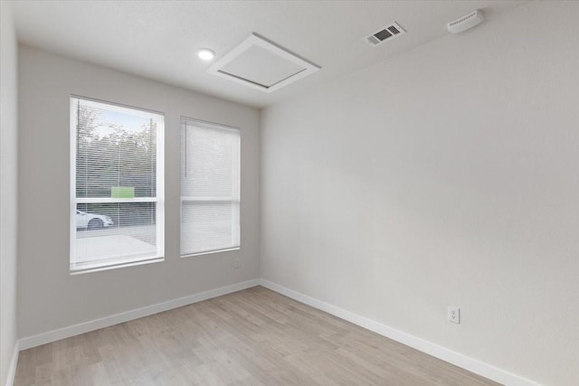 spare room with light wood-type flooring