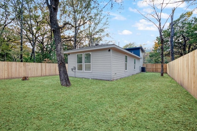 exterior space featuring a yard and central air condition unit