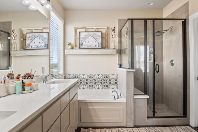 bathroom featuring vanity and plus walk in shower