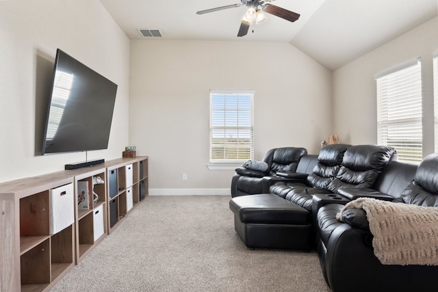 carpeted living room with lofted ceiling and ceiling fan