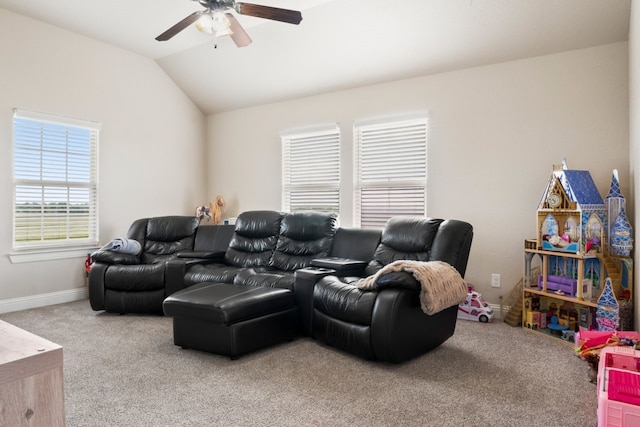 carpeted home theater with lofted ceiling and ceiling fan