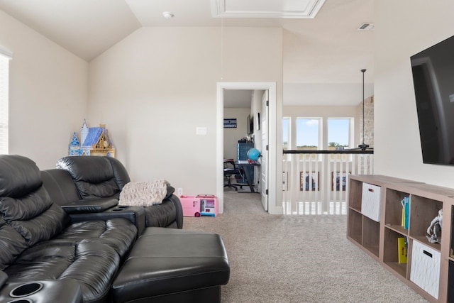 carpeted living room featuring lofted ceiling