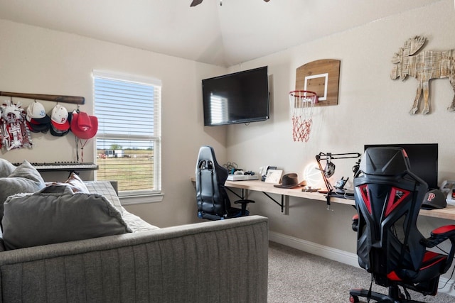 carpeted office with ceiling fan and vaulted ceiling