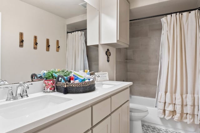 full bathroom featuring vanity, toilet, and shower / bath combination with curtain